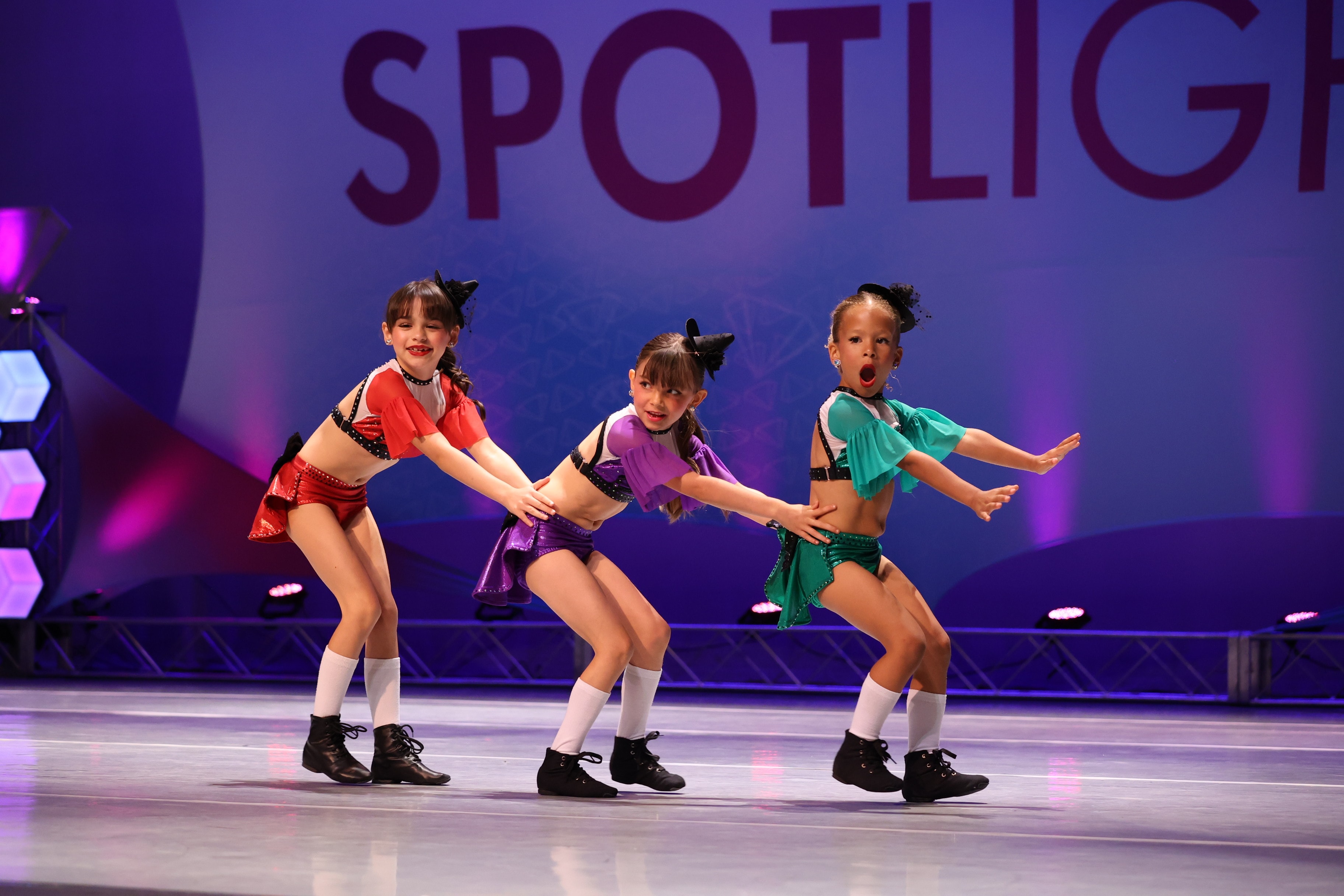 Three KPAC dancers performing jazz trio on the Spotlight stage
