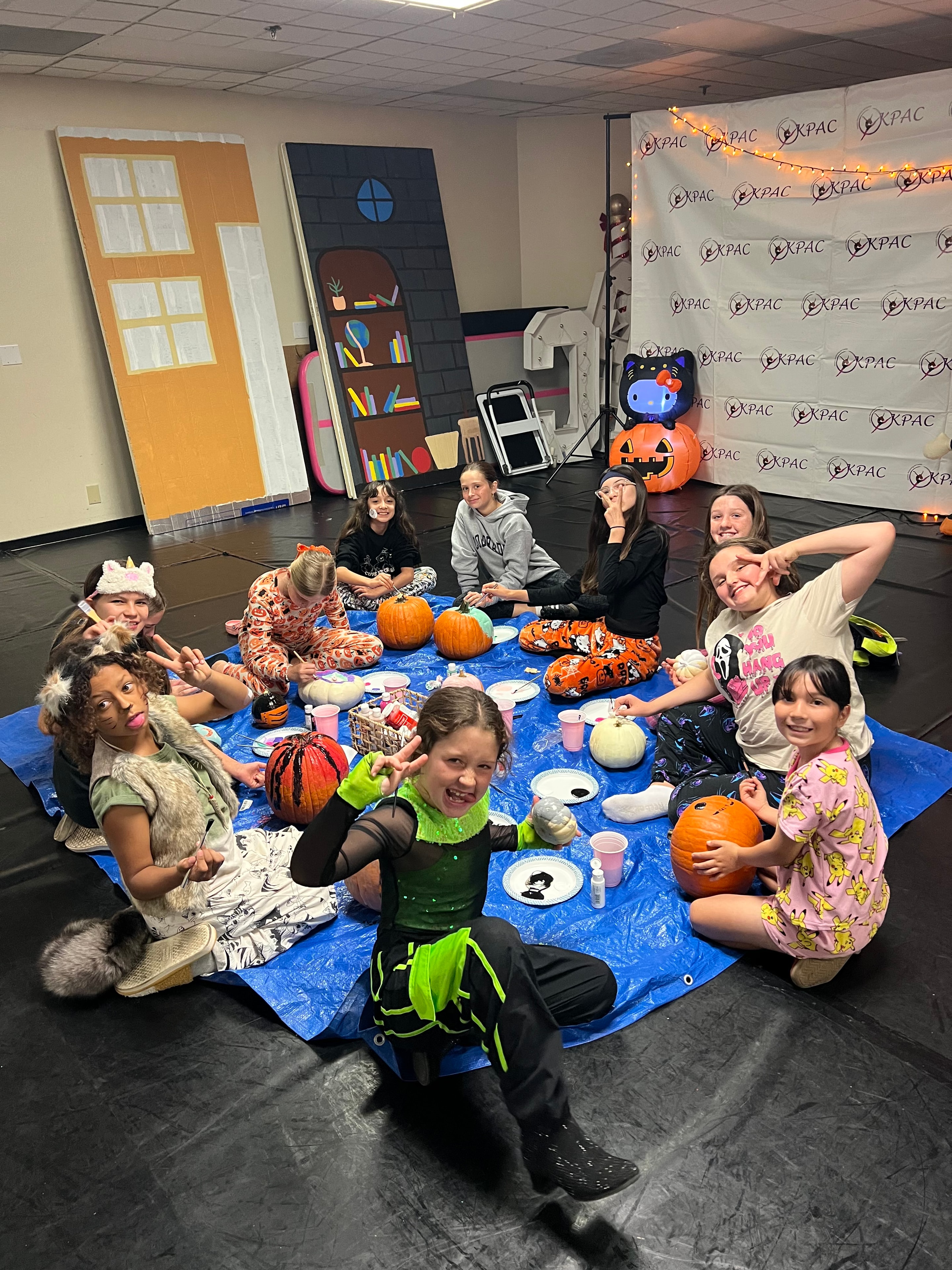 KPAC dancers painting pumpkins at Halloween party