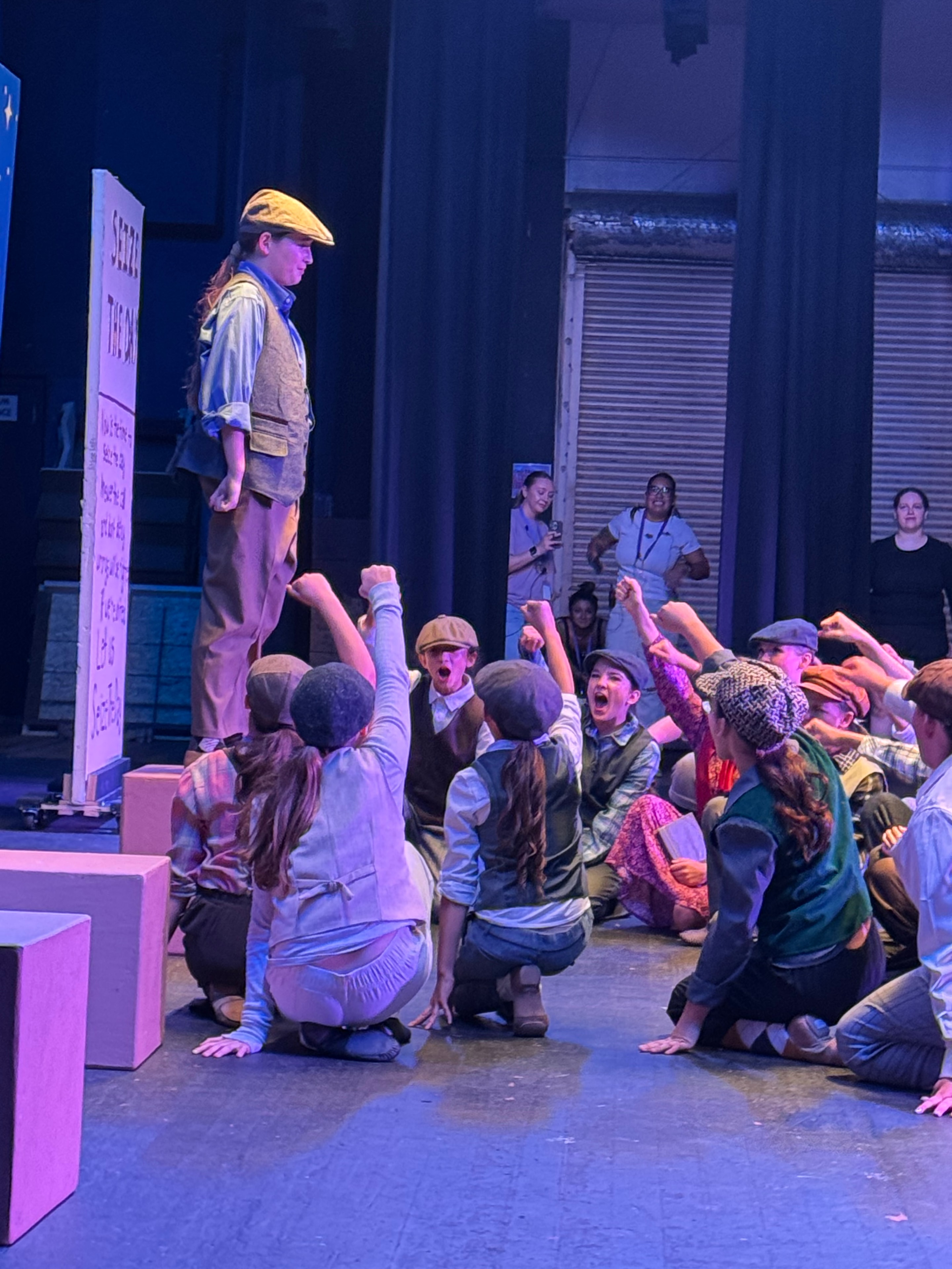 Full Newsies cast on stage